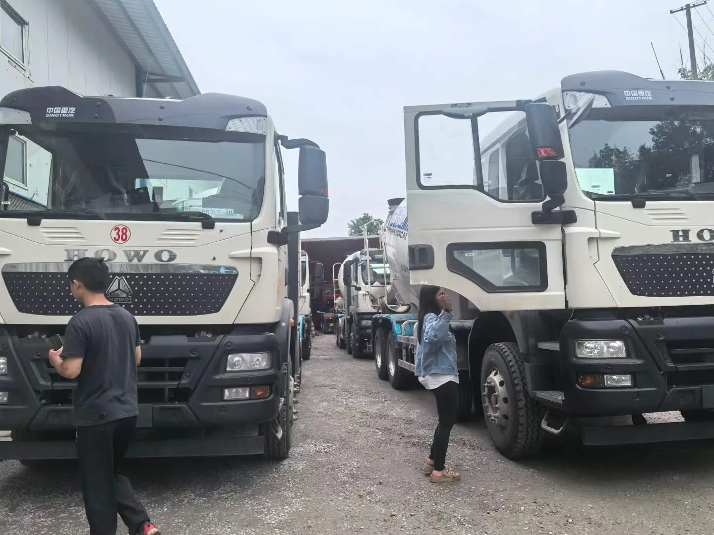 HOWO mixer trucks in inspection yard for configuration review