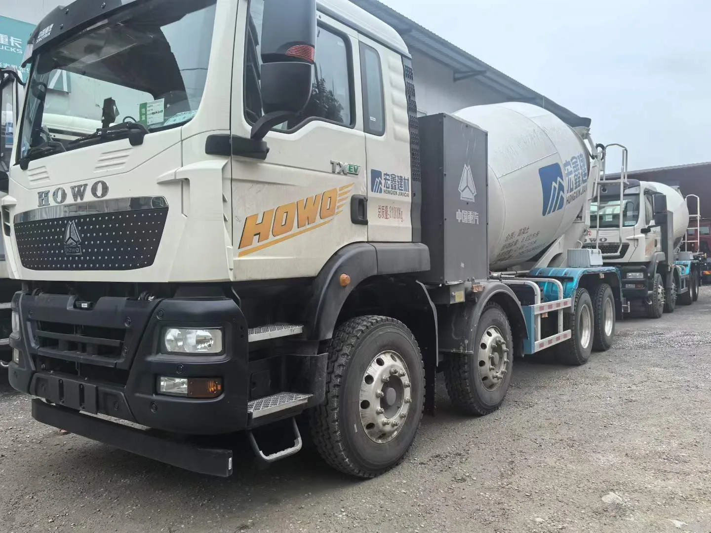 SINOTRUK HOWO concrete mixer trucks in inspection yard